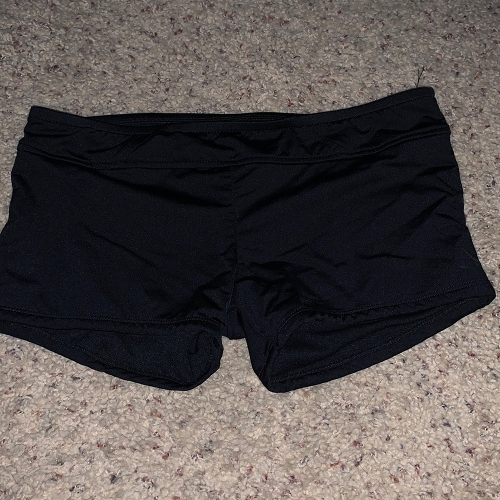 Black swim shorts.